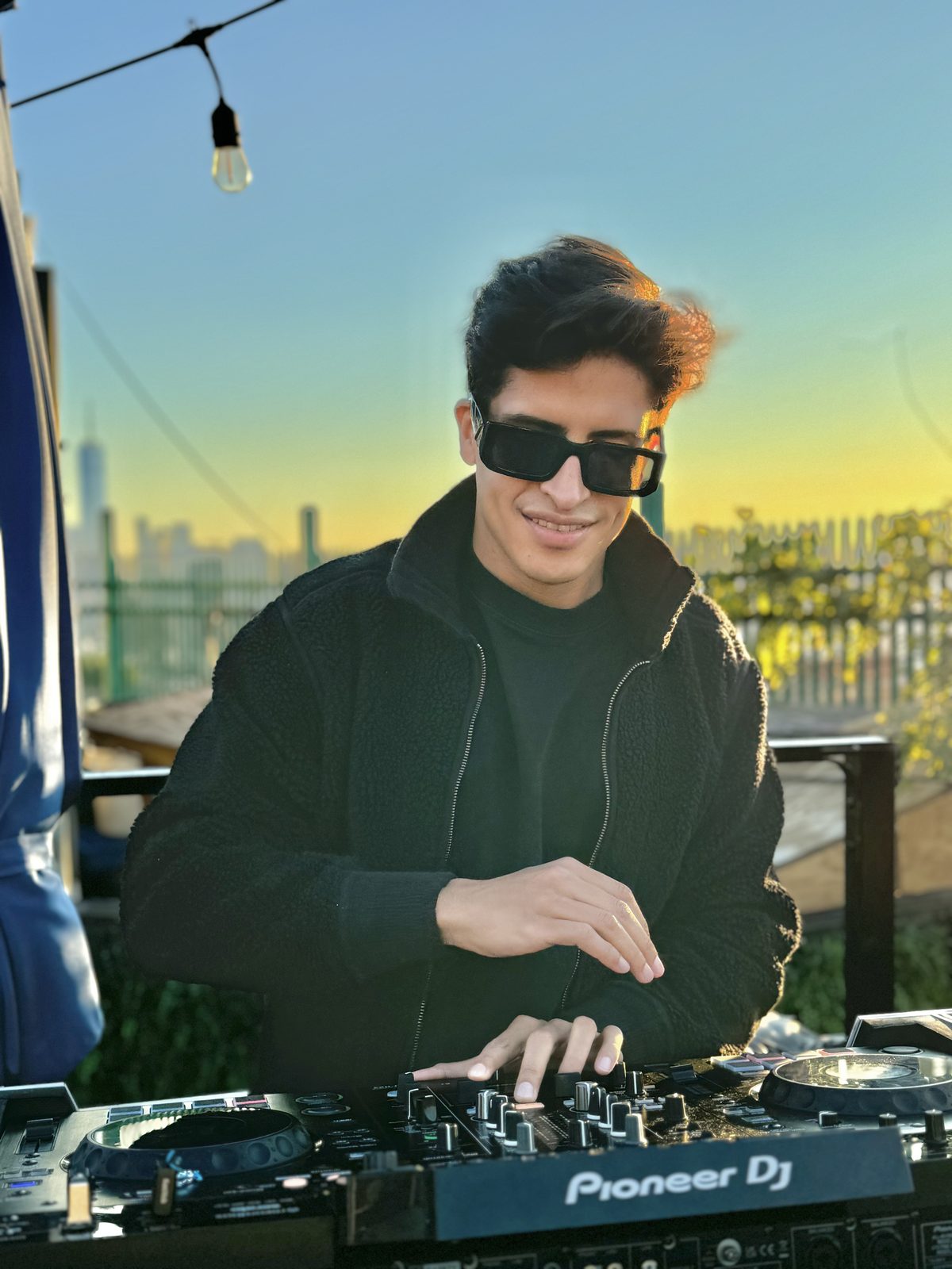 Vallber DJing at sunset in New York City